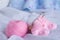 Pretty pink woolen baby socks on white background