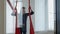 Pretty pole dancer working out in class with aerial silk