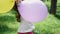 pretty preschool girl having fun playing with hot air balloons outdoors. hollidays, party, birthday, celebration. happy