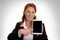 Pretty red-haired business woman with mini tablet pc