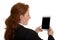 Pretty red-haired business woman taking picture with mini tablet