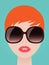 Pretty redhead woman in trendy sunglasses