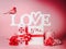 Pretty romantic composition for Valentines day. Love you message with gift box, red ribbons and decoration. Festive greeting