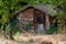 Pretty self-built wooden cabin in a wooded garden
