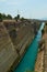 Pretty Shot Of The Corinth Canal With Precise Bridges Crossing It From One Side To The Other. Architecture, Travel, Landscapes.