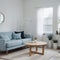 Pretty simple decor of living room with blue sofa and light blue wall