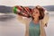 Pretty skater girl holding skateboard