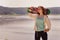 Pretty skater girl holding skateboard