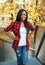 Pretty smiling african woman wearing a red checkered shirt