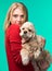 Pretty smiling girl with american spaniel