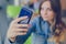 Pretty smiling woman taking selfie, focus on mobile phone. Blurred girl on the background, cell, phone, cellphone, cellular, smart