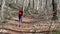 Pretty spanish women running in the forest at springtime