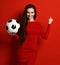 Pretty sport woman player hold soccer ball in hand celebrate show yes win success sign happy up with free text copy space