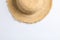 Pretty straw hat on white background. Space for text