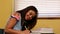 Pretty student studying at desk in classroom