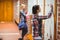 Pretty students opening lockers