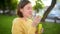 Pretty teenage girl blowing soap bubbles on a sunset. Child having fun in a park in summer.