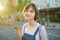 Pretty teenage girl eating tasty fresh ice cream outdoors on warm and sunny summer day. Children eating sweets