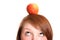 Pretty teenager balancing an apple on her head