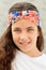 Pretty teenager girl with a flowered headband