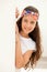 Pretty teenager girl with a flowered headband