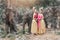 Pretty thai girls in traditional thai costumes with elephants