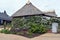 A pretty thatched cottage with walls covered in flowers in a Hyde Park, Essex