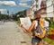 Pretty traveler woman with backpack in a city