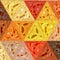 Pretty triangle background in orange, yellow and red colors, sunny background effect patchwork transparent glass effect