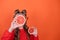 pretty tween girl in orange with a grapefruit isolated on orange background. tropical citrus fruit Grapefruit slices