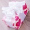 Pretty Valentines gift with hearts on the giftwrap