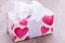 Pretty Valentines gift with hearts on the giftwrap