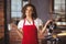 A pretty waitress holding a jug