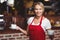 Pretty waitress holding two cups of coffees