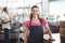 Pretty waitress leaning on counter