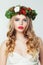 Pretty woman with blonde curly hair and red lips makeup, Christmas concept