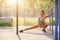 Pretty woman doing sport stretching exercises in the summer outdoor.