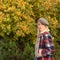 Pretty woman in hat. Woman wear checkered clothes nature background. Girl wear kepi. Fall fashion accessory. Adorable