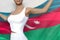 pretty woman holds Azerbaijan flag in hands behind her back on the white background - flag concept 3d illustration