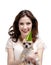 Pretty woman hugs a straw-colored small dog