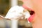 Pretty woman lips with icecream in the spoon