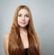 Pretty woman with long natural ginger straight hair portrait