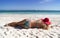 Pretty woman lying on the caribbean beach