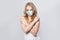 Pretty woman in medical mask portrait. Girl wearing protective face mask on white