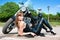 A pretty woman near by motorcycle