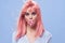 pretty woman with pink hair sweets mouth emotions blue background