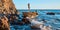 Pretty woman posing on rock. Rocky coastline and sharp cliff. Vacation time. Summer holiday and travelling concept