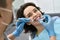 Pretty woman`s teeth treatment in dental clinic