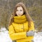 Pretty woman in a yellow knit scarf.