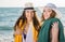 Pretty Women in Summer Hats at the Beach